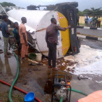 FULLY LOADED FUEL TANKER CRASHES, SPILLS CONTENT AT MURTALA MUHAMMED INT’L AIRPORT TOLL GATE (PICTURES)